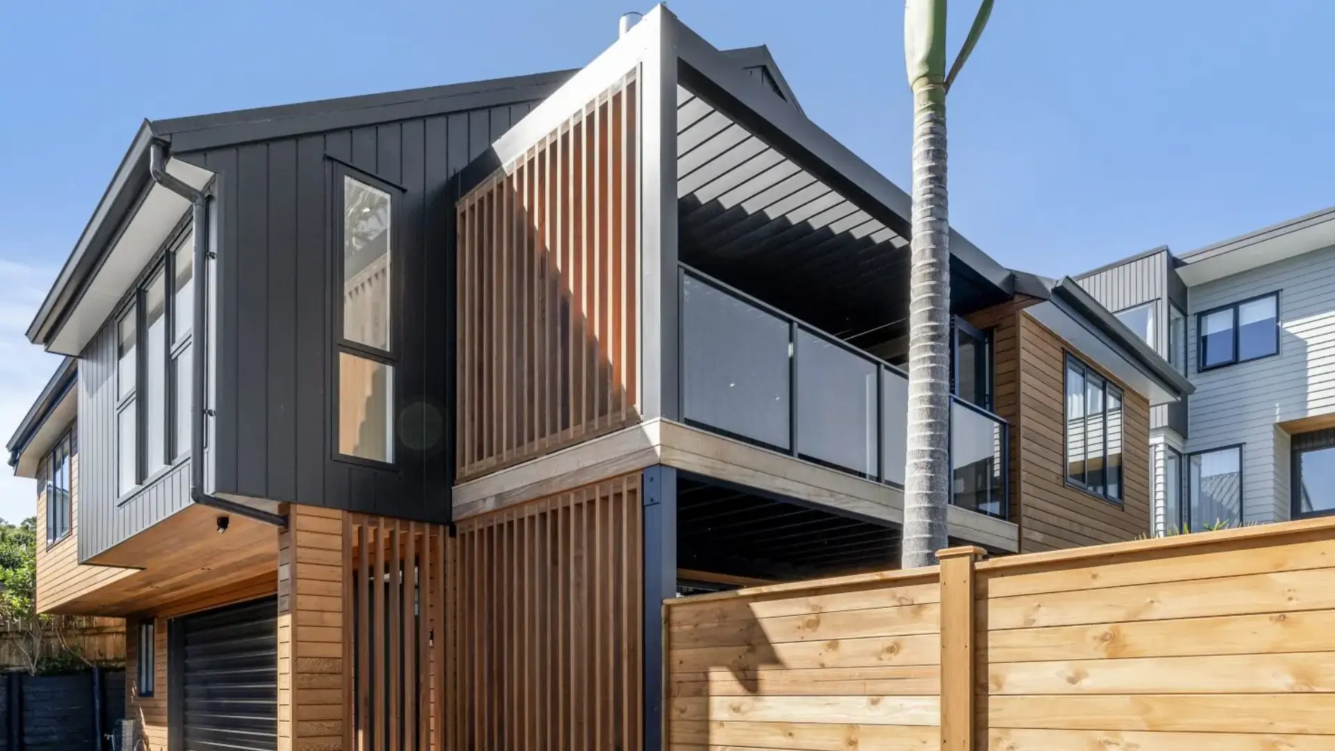 Modern home exterior with new wall cladding showing the best recladding company in Matakana for leaky homes and full reclad Recladding Matakana.