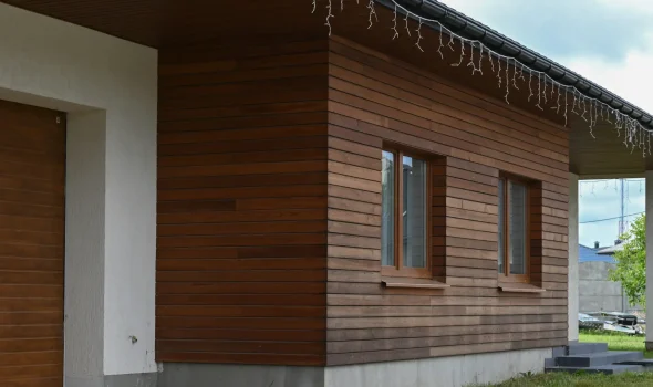 Full Reclad Planning And Coordination For Recladding Matakana Home exterior with timber wall finish showing full reclad planning and coordination by Recladding Matakana.